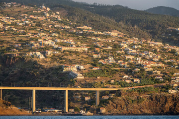 tall bridge and urban sprawl on shore east of Funchal, Madeira