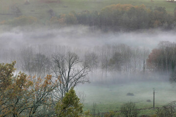 Fototapeta premium Early evening mist in Autumn in the Dordogne, France 