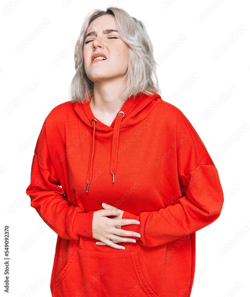 Sticker Young blonde girl wearing casual clothes with hand on stomach because nausea, painful disease feeling unwell. ache concept.