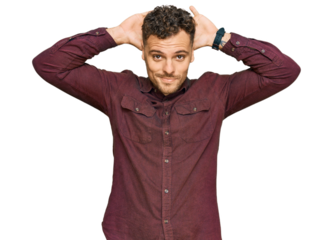 Young hispanic man wearing casual clothes doing bunny ears gesture with hands palms looking cynical and skeptical. easter rabbit concept.