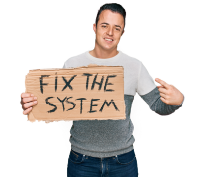 Handsome young man holding fix the system banner cardboard smiling happy pointing with hand and finger