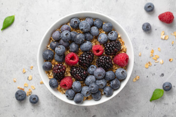 bowl granola of blueberries and raspberries