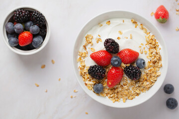 Granola made of Greek yogurt with fresh berries, top view. Healthy food, snacks or breakfast.