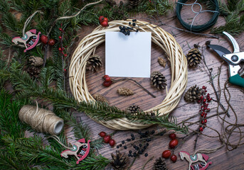 Christmas wreath with white card. Christmas decoration, background