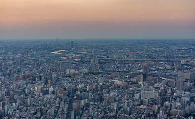 Fototapeta na wymiar City over the sunset