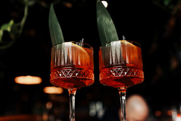 cocktail Aperol spritz in glasses. Cocktail aperol spritz decorated fresh orange slices, ice,...