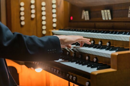 Closeup Shot Of A Man Playing An Organ.