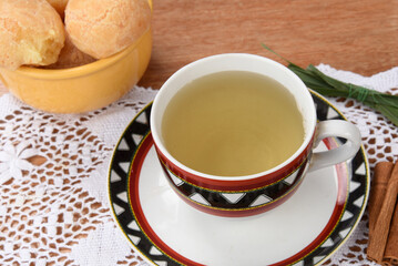 cup of lemongrass green tea with cheese bread breakfast
