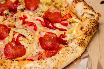 Fresh whole pizza in open box