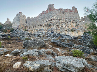 Ancient old medieval fortress, castle, hidden ruins made of stones in a tourist warm tropical eastern country southern resort