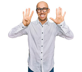 Bald man with beard wearing business shirt and glasses showing and pointing up with fingers number nine while smiling confident and happy.