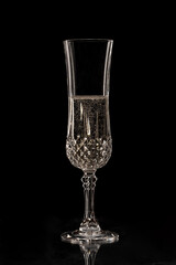 champagne crystal glass on black background