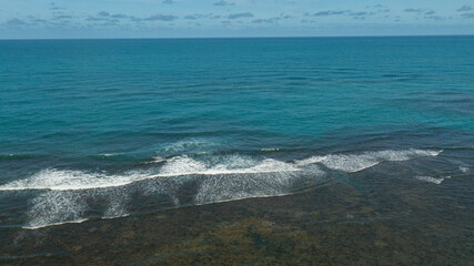 aerial view of coral reefs and sea with blue water
