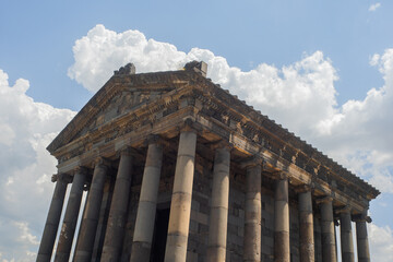 Fototapeta premium The temple in Garni , a pagan temple in Armenia, built in the I century AD. Facade with a classic colonnade on the background of sky