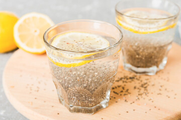 Healthy breakfast or morning with chia seeds and lemon on table background, vegetarian food, diet and health concept. Chia pudding with lemon