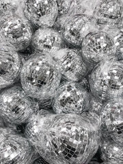 Sale of little disco balls in plastic bags for Christmas tree. Decorative mirror balls for New Year...