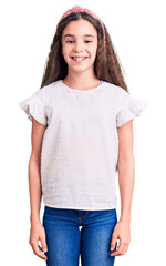 Obraz premium Cute hispanic child girl wearing casual white tshirt with a happy and cool smile on face. lucky person.