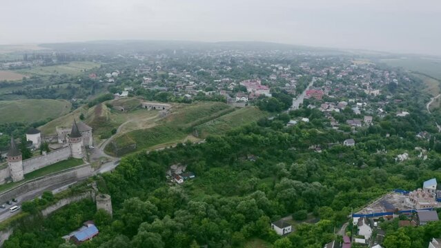 Aerial view of the city panorama of Kamianets-Podilskyi, Ukraine, with gren nature in the background