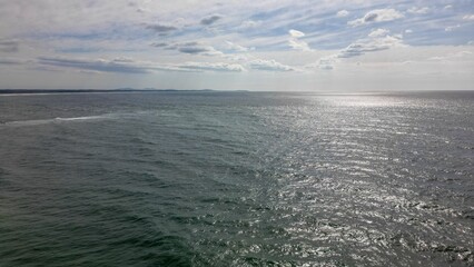 Beautiful view of the gray water surface of the Tasman Sea under the cloudy sky