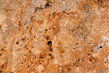 Natural travertine scabos texture background. Traventine stone slab. Large photography.