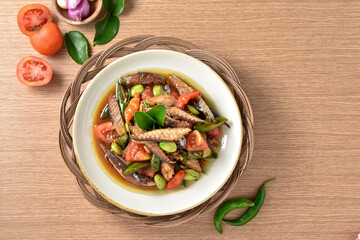 Tumis ikan pindang cue cabai hijau. Practical, fast, and appetizing home recipes. Made from deep-fried tuna and then stir-fried with green chilies, tomatoes, and petai. Served on plate, recipe menu