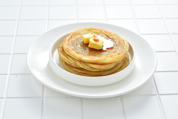 Roti maryam, roti prata, or roti canai are flatbreads or flat pastry originating from India and are...