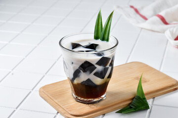 Summer drink Es Cincau Hitam, made from black grass jelly with coconut milk and palm sugar. Has a refreshing taste and can relieve internal heat. 