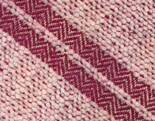 Closeup of handwoven towel in red and white.