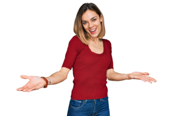 Young blonde girl wearing casual clothes smiling cheerful offering hands giving assistance and acceptance.