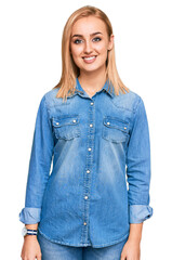 Beautiful caucasian woman wearing casual denim jacket with a happy and cool smile on face. lucky person.