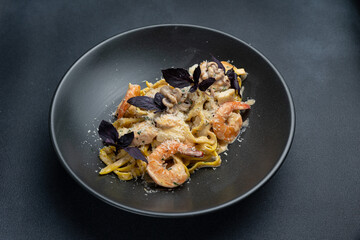 delicious pasta on a dark table in a restaurant

