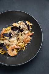 delicious pasta on a dark table in a restaurant
