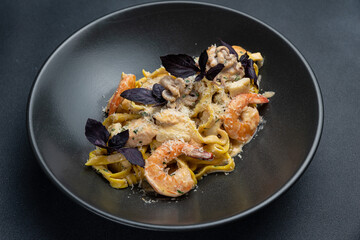 delicious pasta on a dark table in a restaurant
