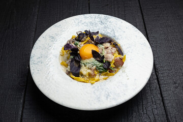 delicious pasta on a dark table in a restaurant
