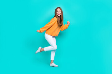Fototapeta na wymiar Full body photo of young excited cute lady wear trendy outfit dancing celebrating finally weekend relax isolated on aquamarine color background