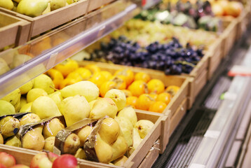 buying fruits(grape,apricots and peaches)  at the market
