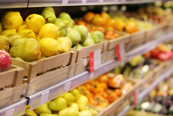 buying fruits(pears, apples,quince)  at the market