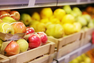buying fruits(pears, apples,)  at the market