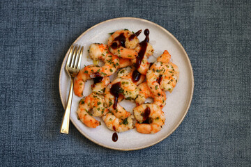 Asian style cooked shrimp with hot spices on a plate.