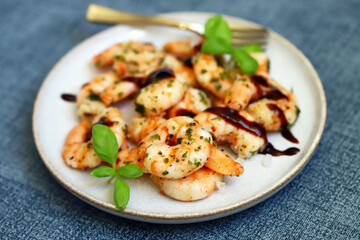 Asian style cooked shrimp with hot spices on a plate.
