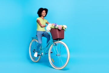 Full length size photo of little funny active positive schoolgirl teenager riding her retro bicycle...