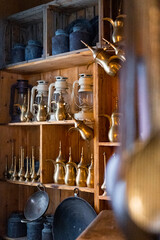 Arabic lanterns and flask on wooden shelf in a vintage store
