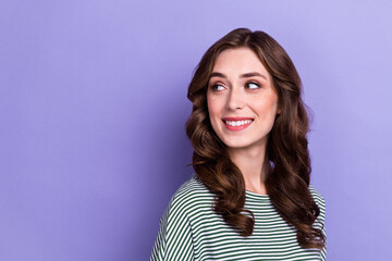 Fototapeta premium Closeup photo of young dreamy lady curly hair looking empty space information about opening new travel agency isolated on violet color background