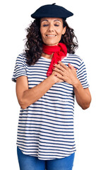 Middle age beautiful woman wearing french beret and scarf smiling with hands on chest with closed eyes and grateful gesture on face. health concept.