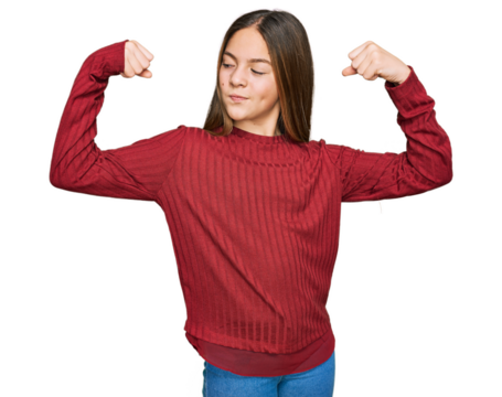 Beautiful brunette little girl wearing casual sweater showing arms muscles smiling proud. fitness concept.