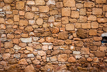 Background. Stone wall. Yellow bricks. Yellow stones wall. pattern.