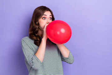 Photo of carefree positive crazy lady hold blow inflate big air balloon look empty space gift shop...