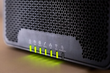 LED indicators of a router flash with a Wi-Fi signal.