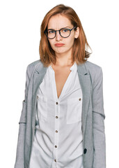 Young caucasian woman wearing business style and glasses depressed and worry for distress, crying angry and afraid. sad expression.