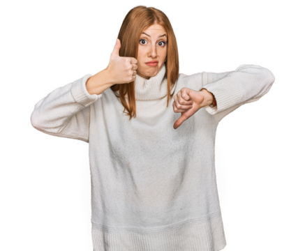 Young irish woman wearing casual winter sweater doing thumbs up and down, disagreement and agreement expression. crazy conflict